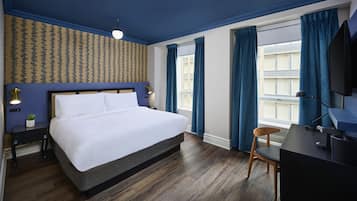 Deluxe Room, 1 King Bed | Pillowtop beds, desk, blackout drapes, iron/ironing board