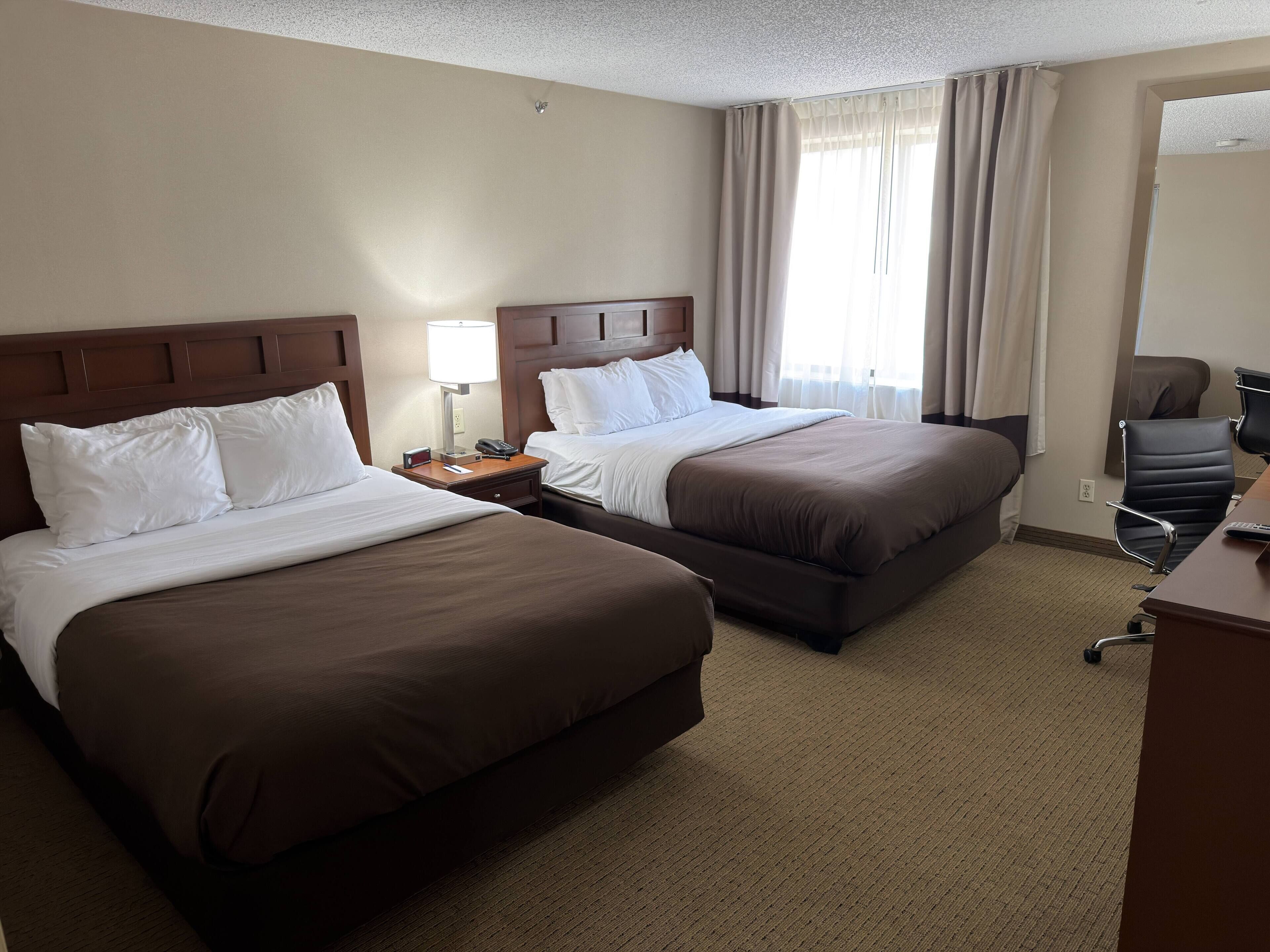 Deluxe Room, 2 Queen Beds, Non Smoking | Premium bedding, desk, laptop workspace, blackout drapes