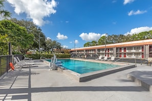 Outdoor pool, pool umbrellas, sun loungers