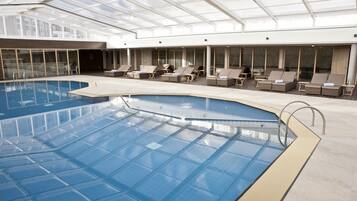 Indoor pool, open 8:00 AM to 10:00 PM, pool loungers