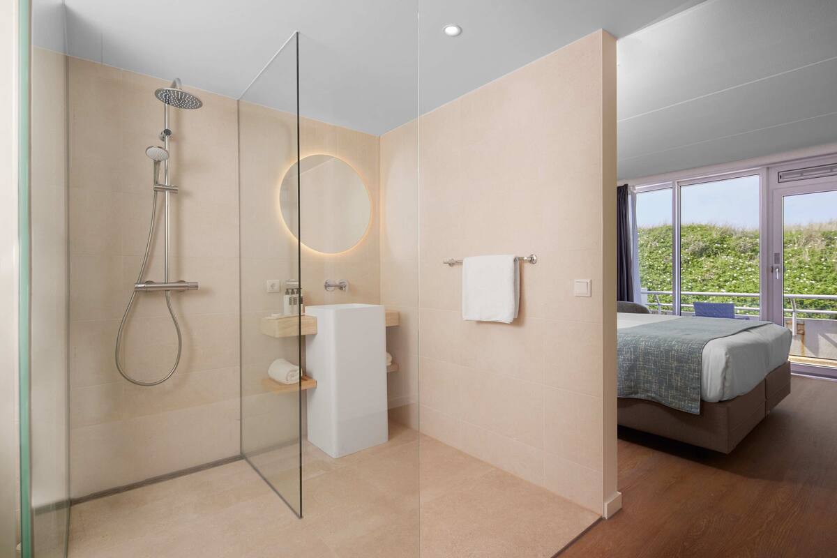 superior double room | bathroom | eco-friendly toiletries, hair dryer, towels