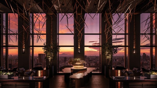 A modern interior with large windows, a central table, and seating areas. - Shinagawa Prince Hotel (Tokyo)