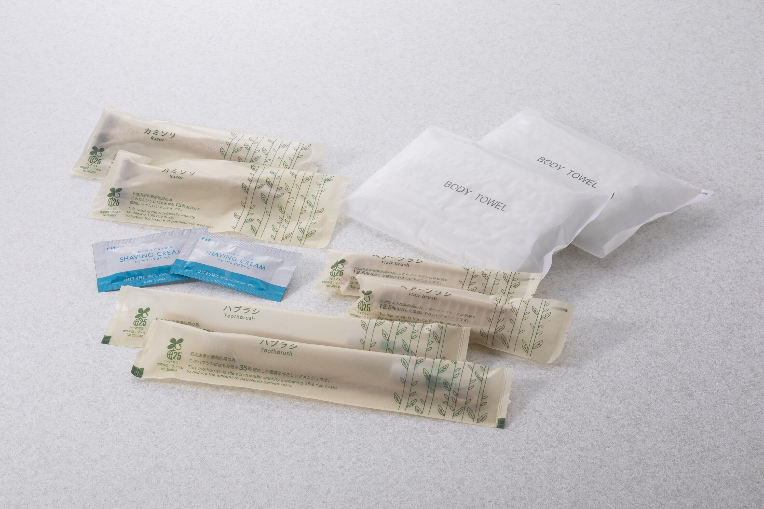 A set of personal care items including body towels, shaving cream, and hairbrushes.