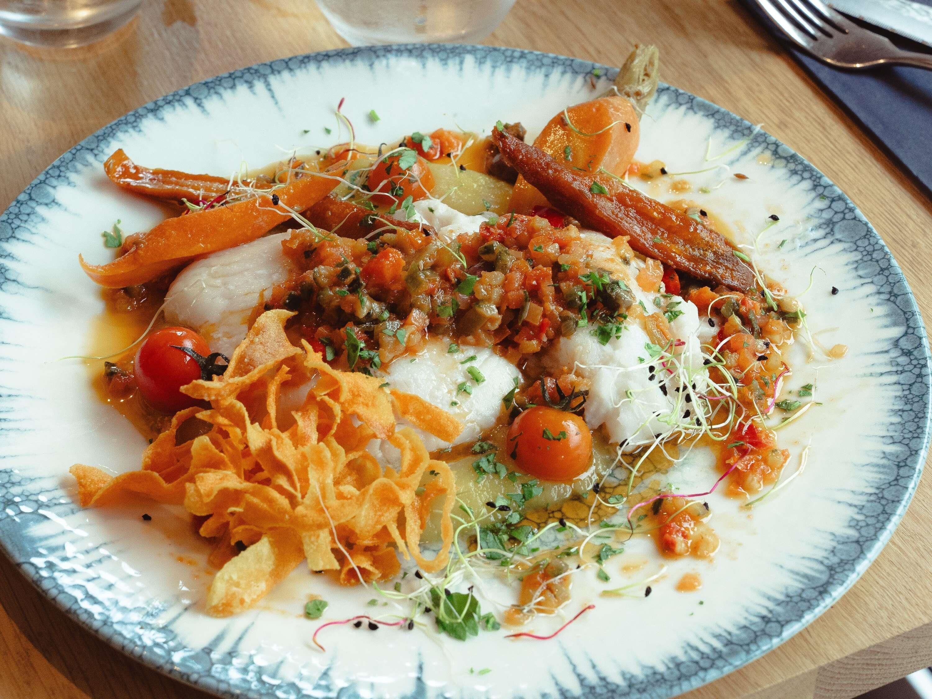 A plate of food with various toppings and garnishes.