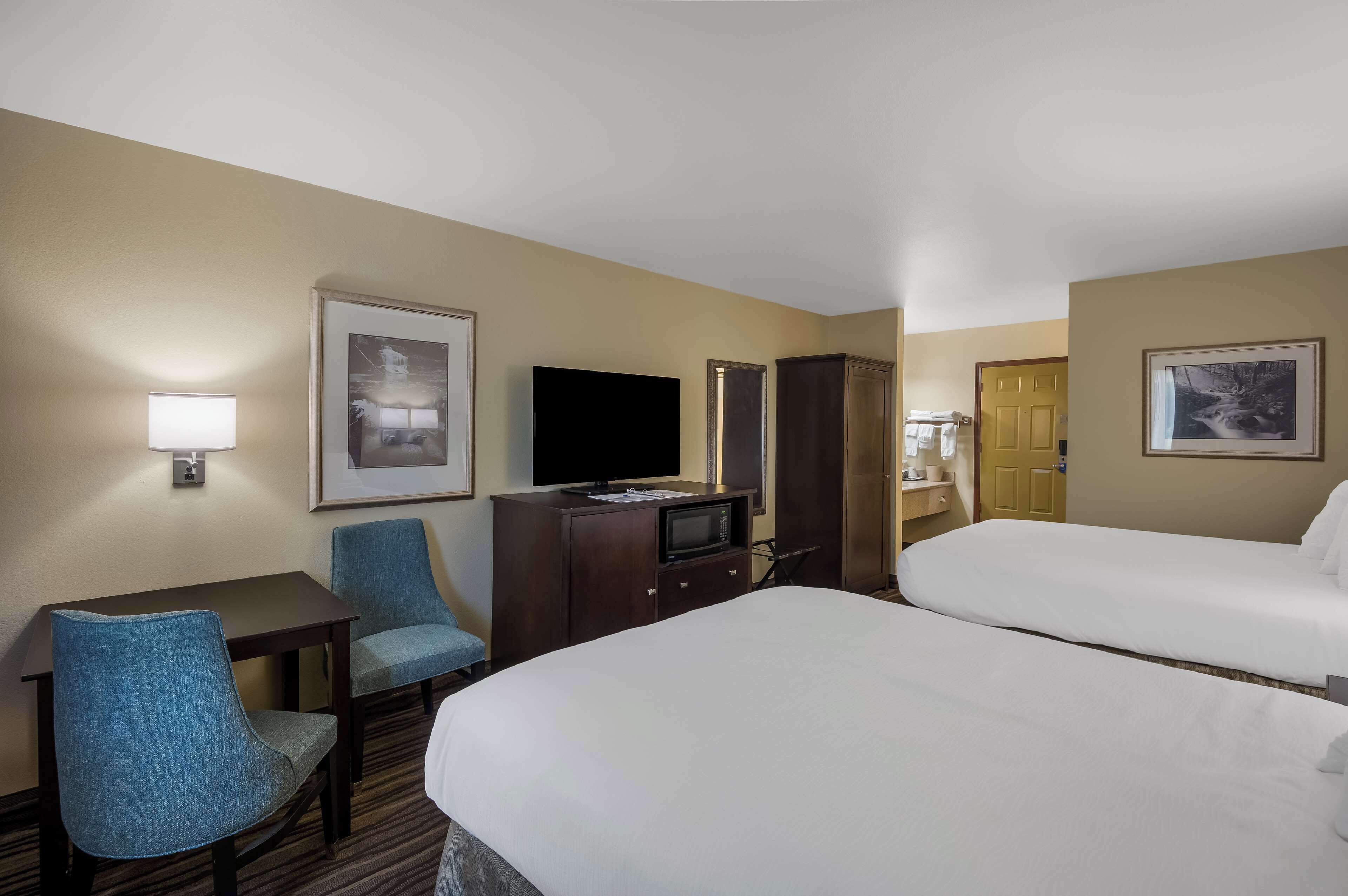 standard room, 2 queen beds, non smoking, refrigerator & microwave | in-room safe, desk, laptop workspace, iron/ironing board