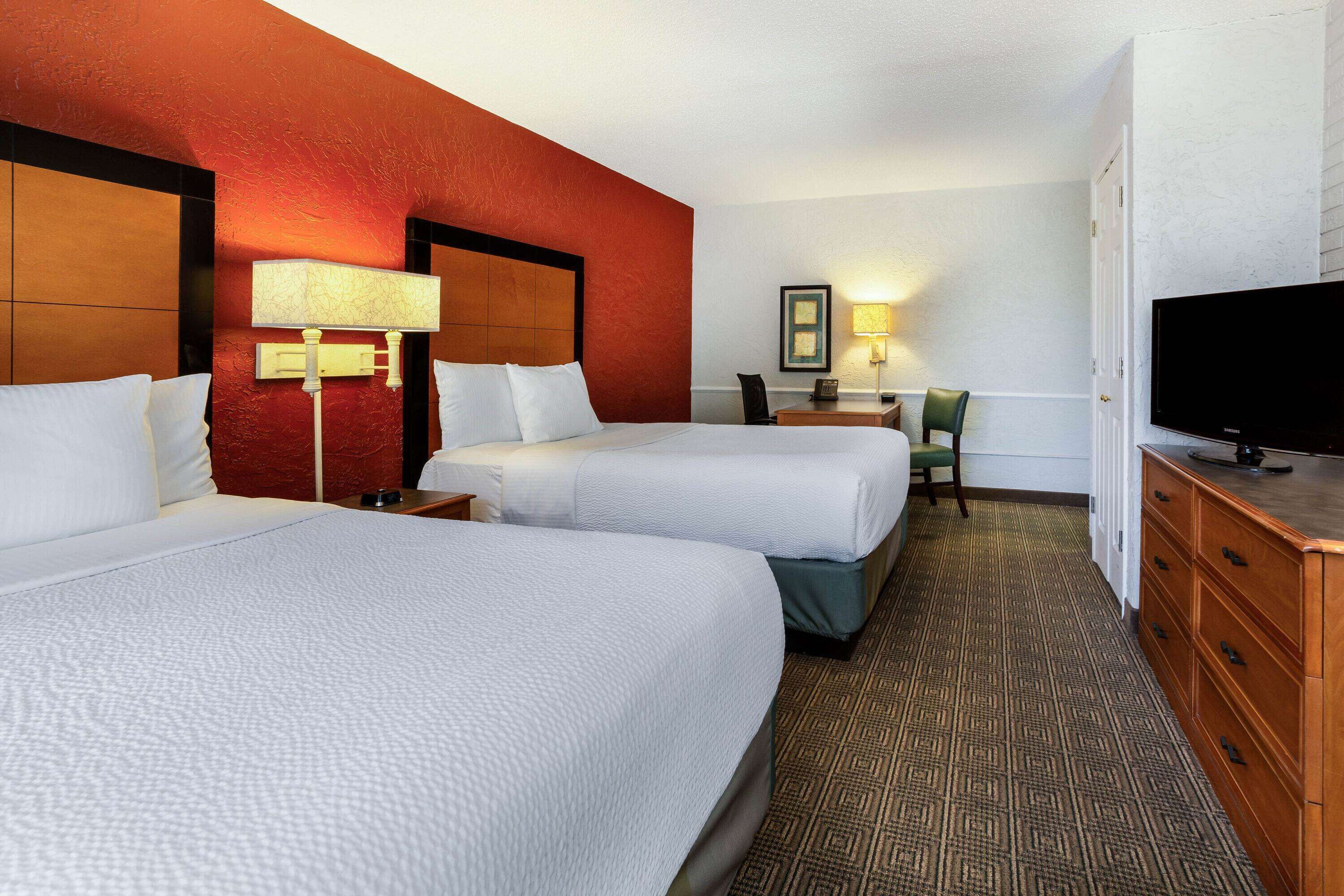 pillow-top beds, desk, blackout curtains, iron/ironing board