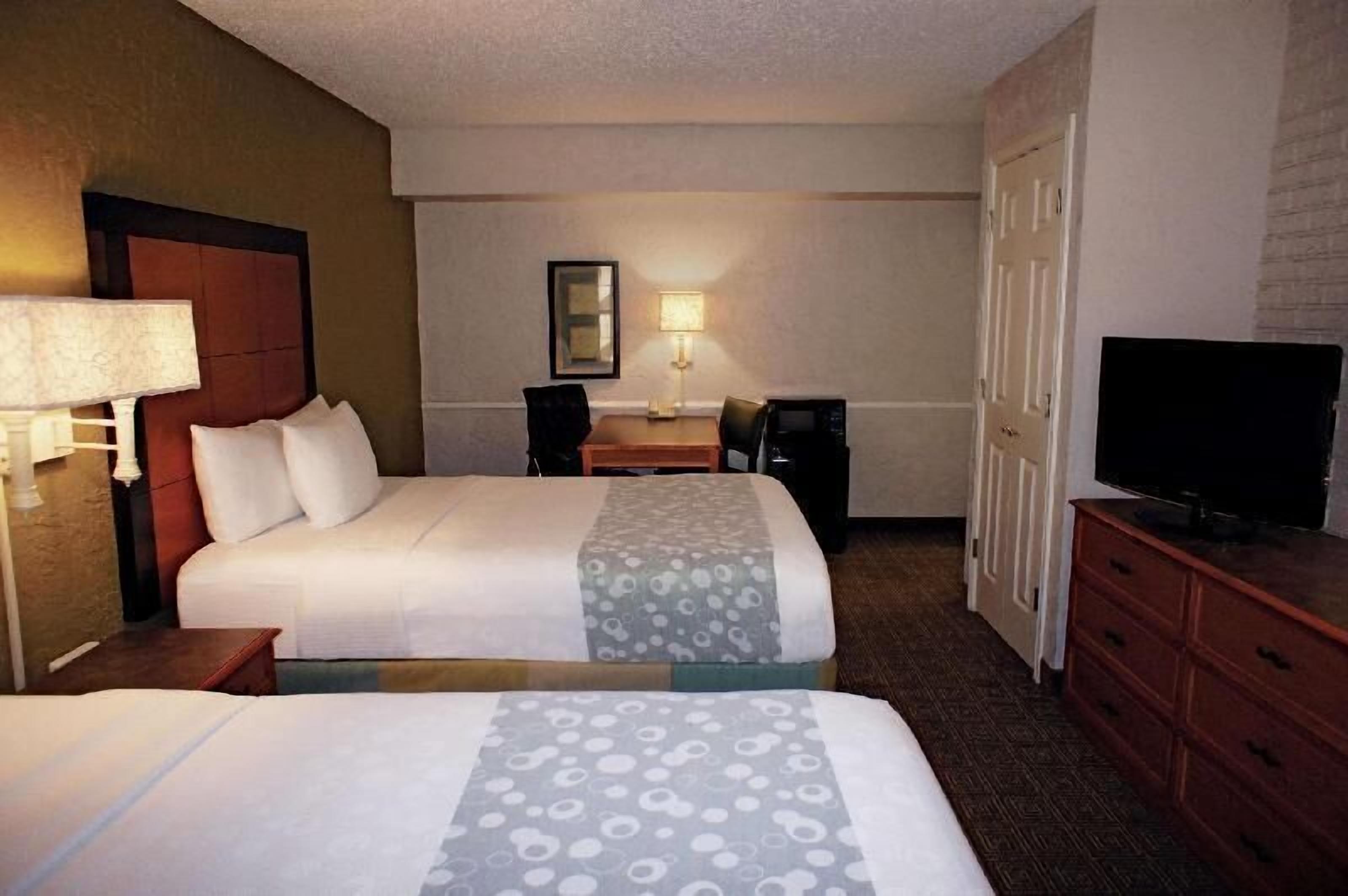 Pillowtop beds, desk, blackout drapes, iron/ironing board