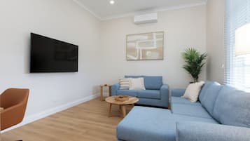 Premium Apartment, 2 Bedrooms | Living area | 32-inch LED TV with digital channels, TV