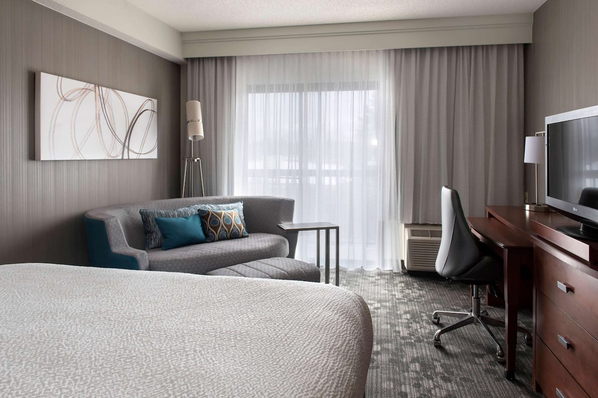 Premium bedding, pillowtop beds, desk, laptop workspace