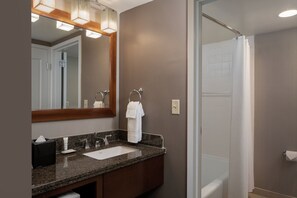 Combined shower/bathtub, designer toiletries, hair dryer, towels