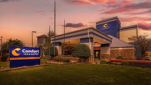 A Comfort Inn & Suites hotel with a modern design, featuring a prominent sign, well-maintained landscaping, and a clear view of the entrance.