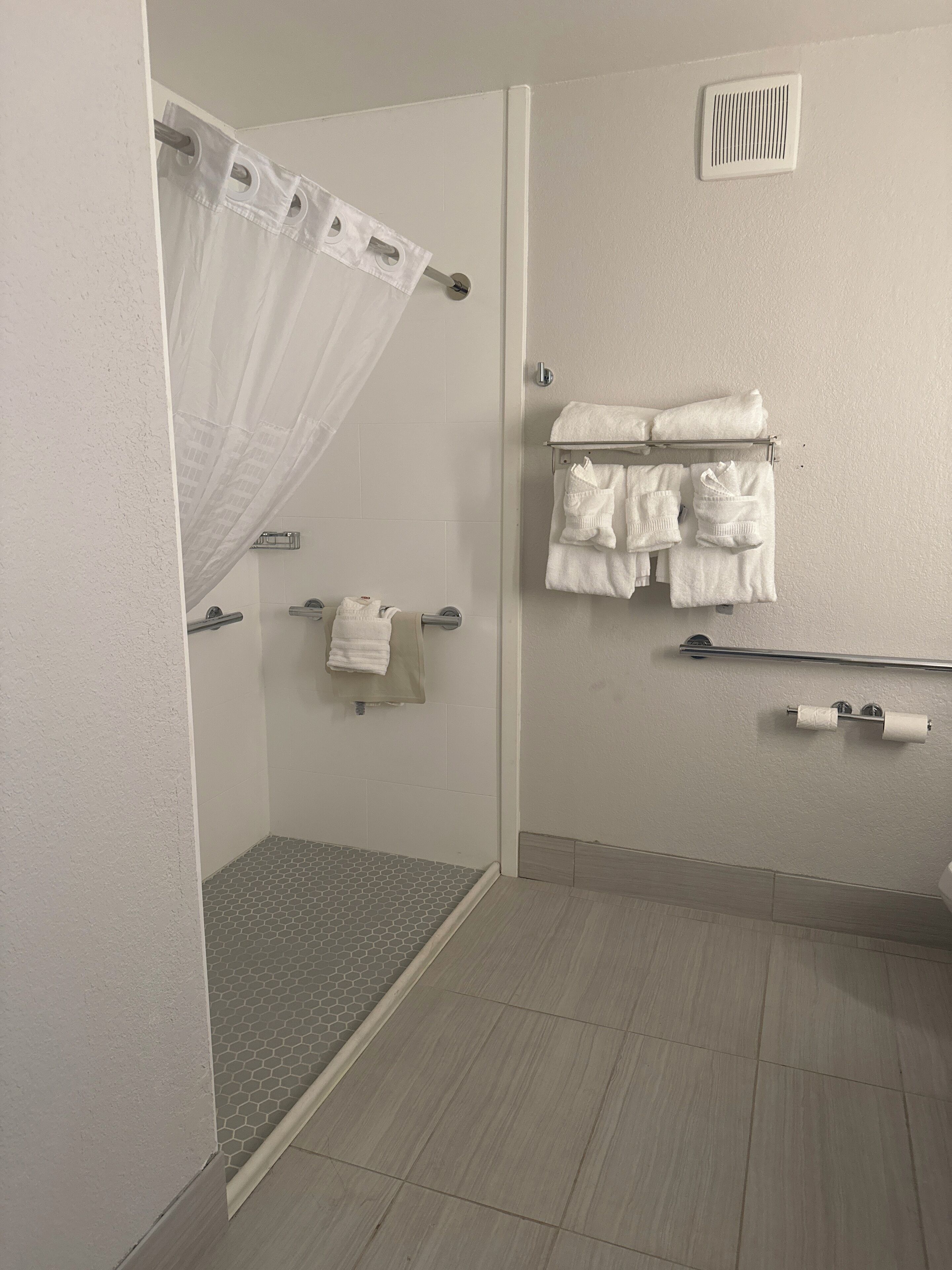 room, 1 king bed, accessible, non smoking | bathroom | combined shower/bathtub, free toiletries, hair dryer, slippers