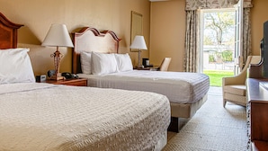 A hotel room with two beds, a desk, a chair, and a television. - Hampton Inn Charleston-Historic District (Charleston)