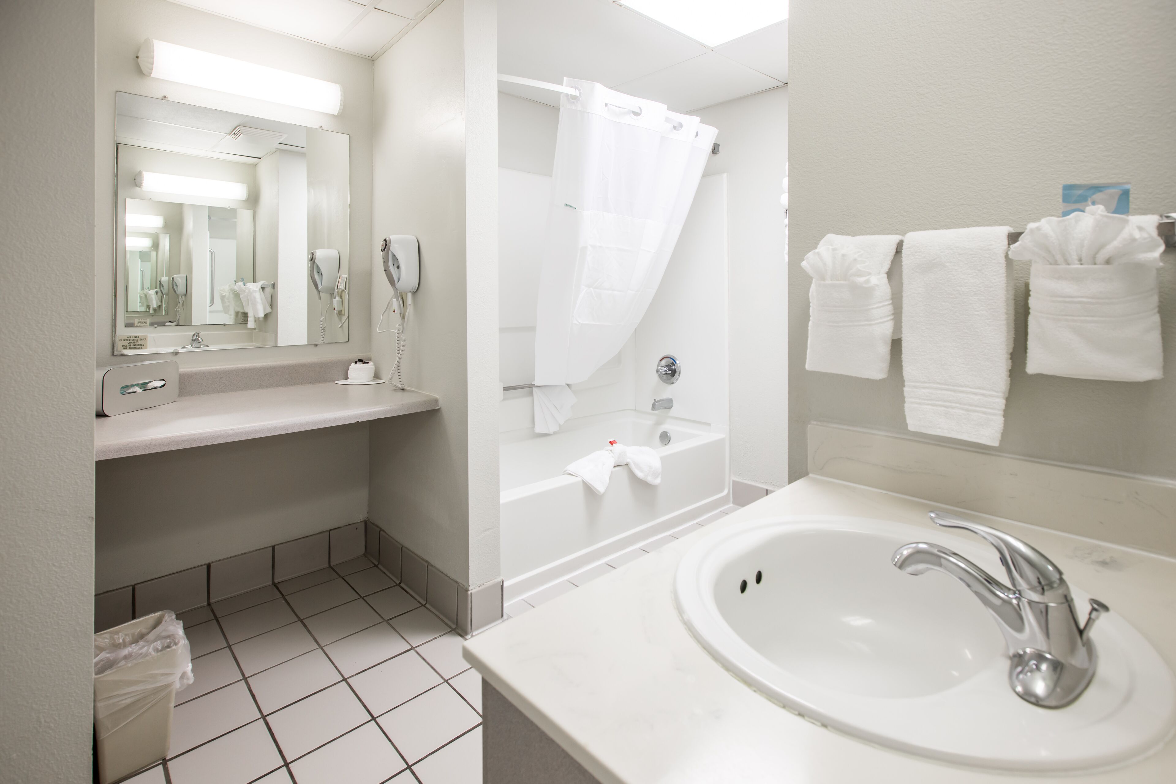 combined shower/bathtub, free toiletries, hair dryer, towels