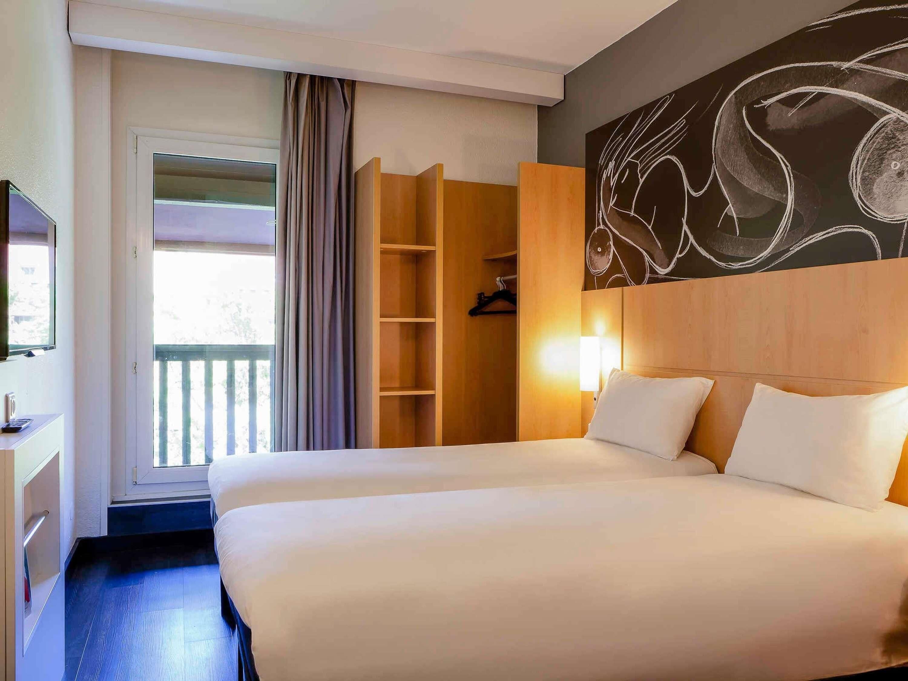 Premium bedding, desk, laptop workspace, blackout curtains