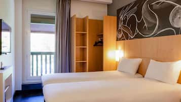 Premium bedding, desk, laptop workspace, blackout curtains