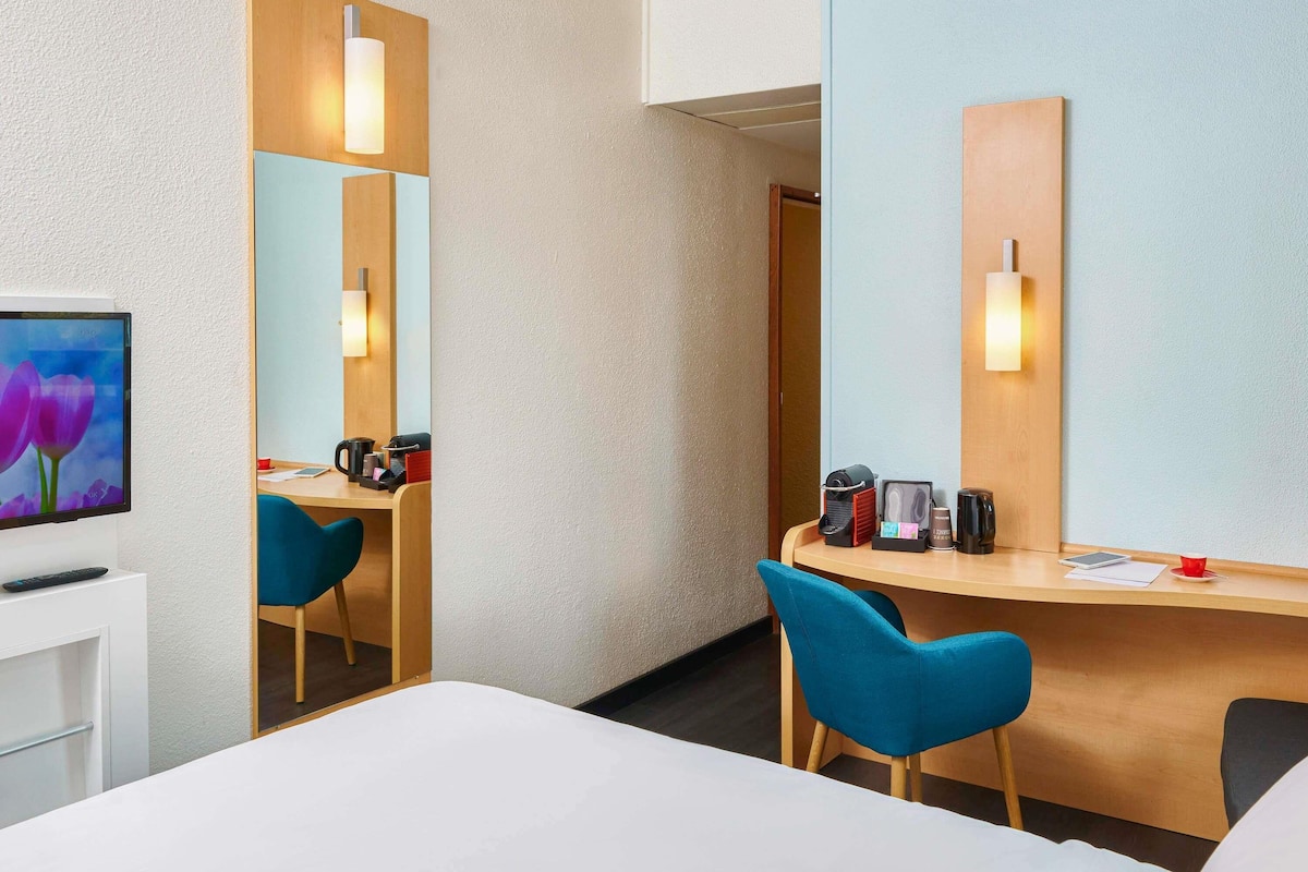 Premium bedding, desk, laptop workspace, blackout curtains