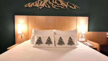 Premium bedding, desk, laptop workspace, blackout curtains