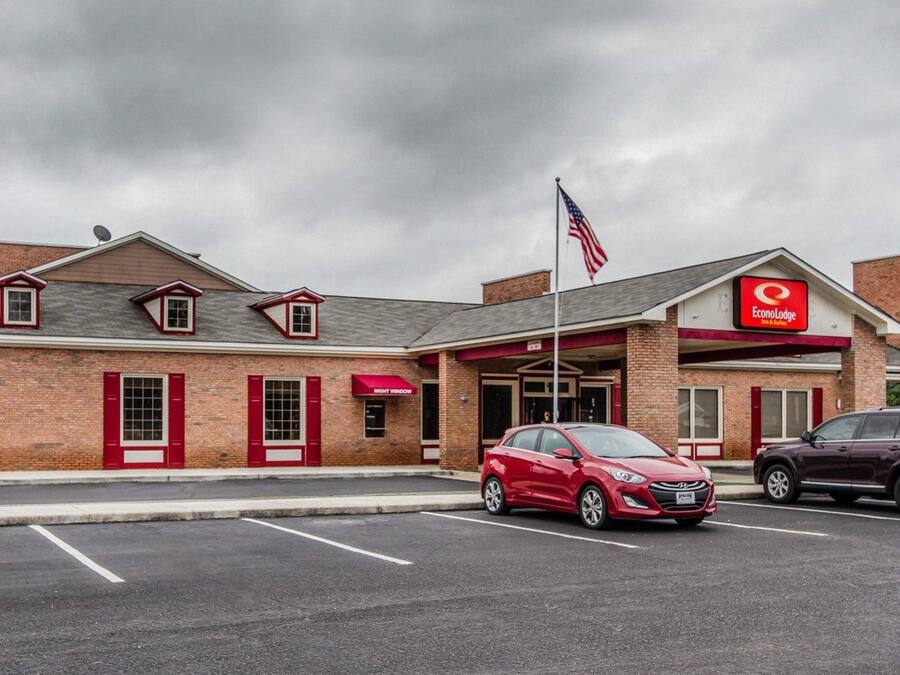 A brick building with a red awning and a sign for EconoLodge.