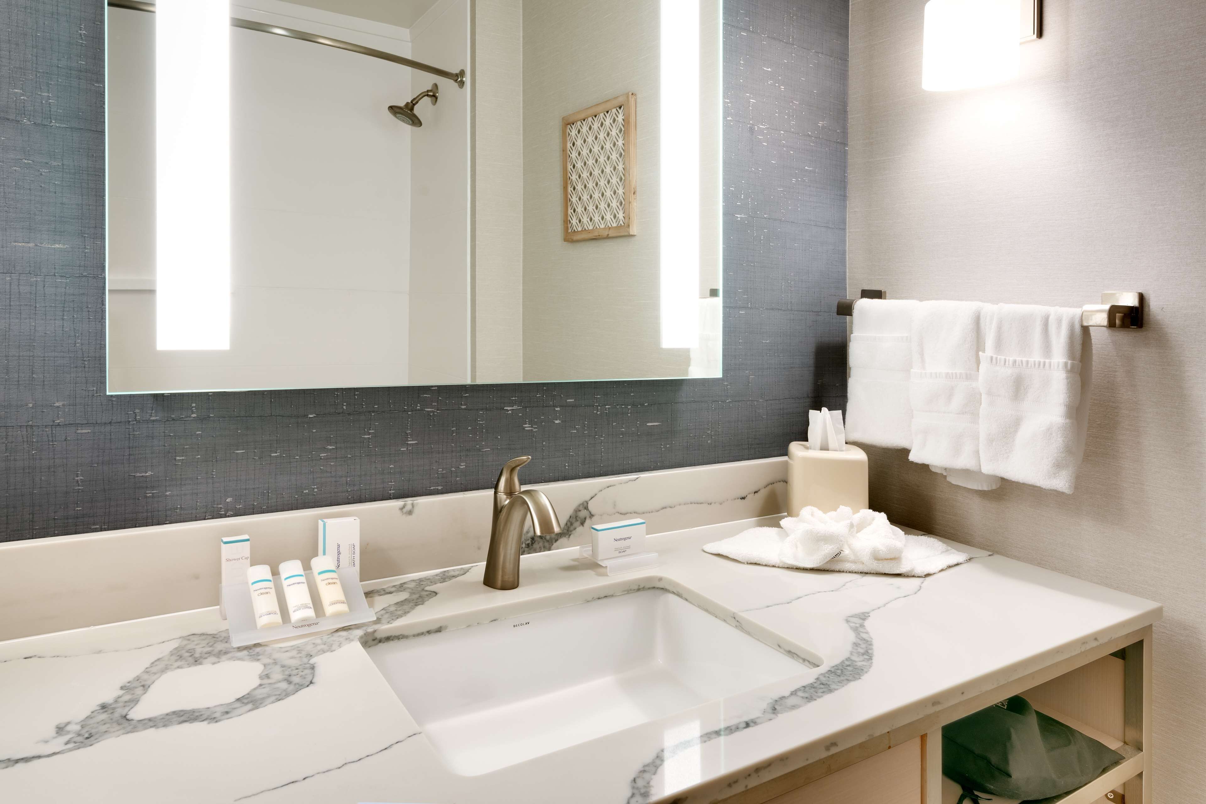 eco-friendly toiletries, hair dryer, towels