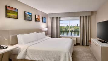 King Riverview Suite | Down comforters, individually decorated, desk, blackout drapes