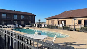 Seasonal outdoor pool, pool loungers