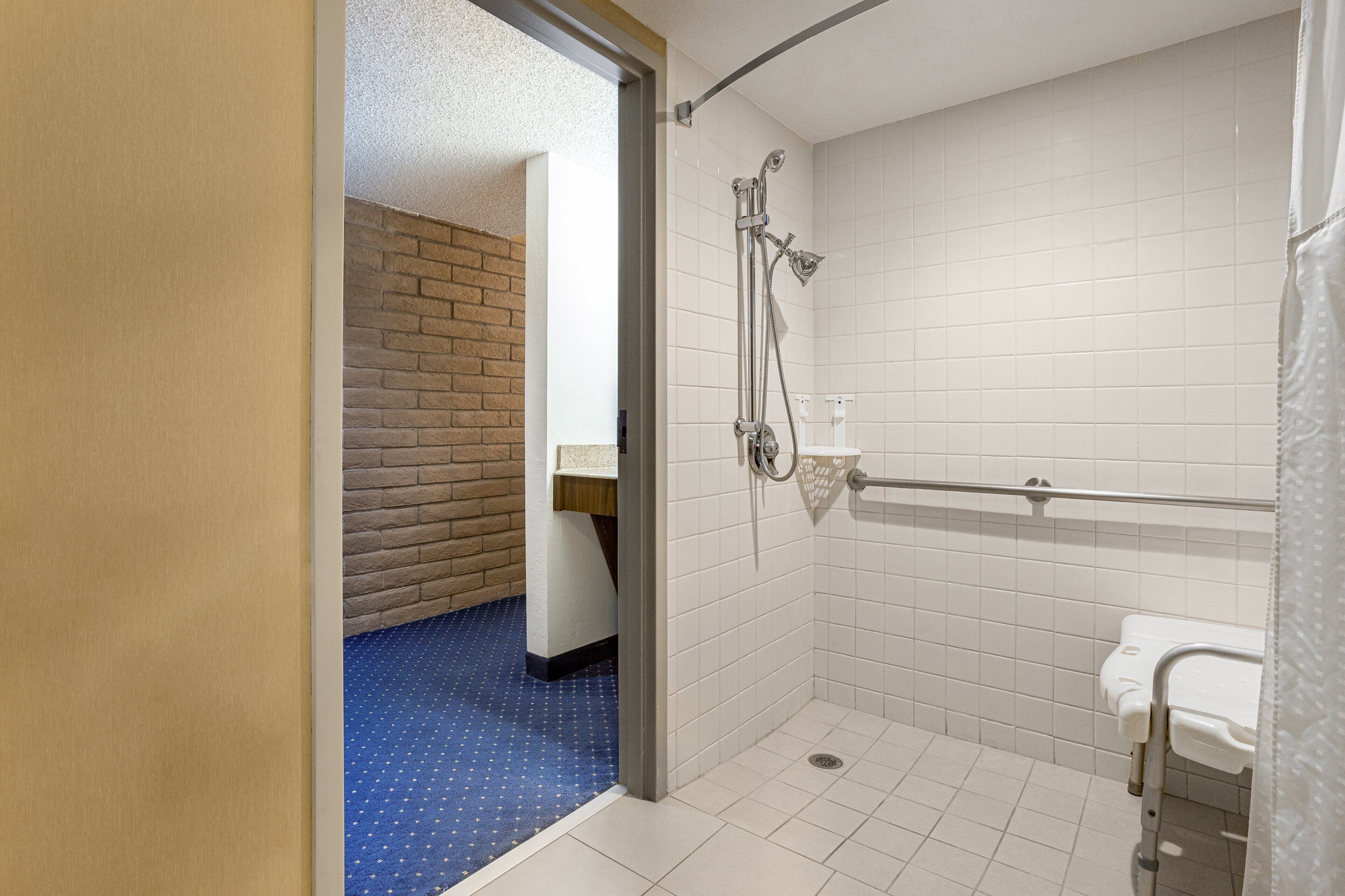 hypo-allergenic bedding, desk, laptop workspace, blackout curtains