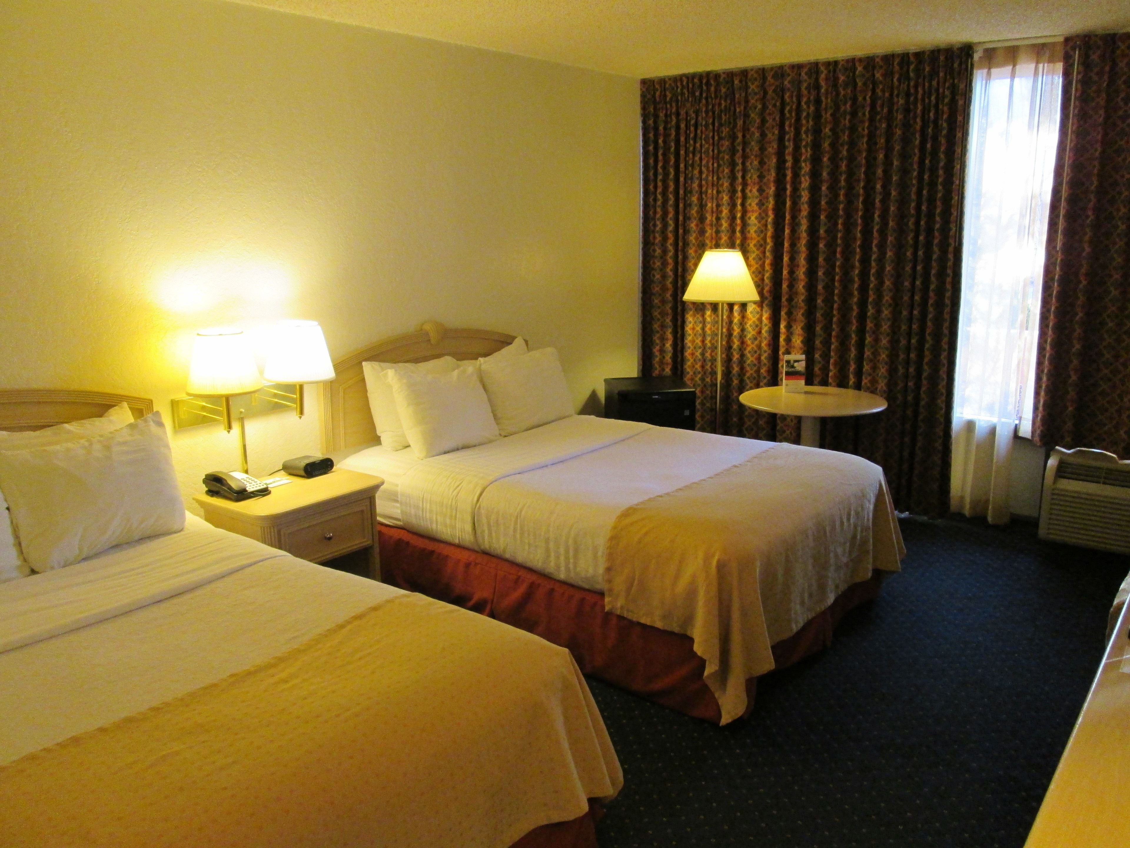 hypo-allergenic bedding, desk, laptop workspace, blackout curtains