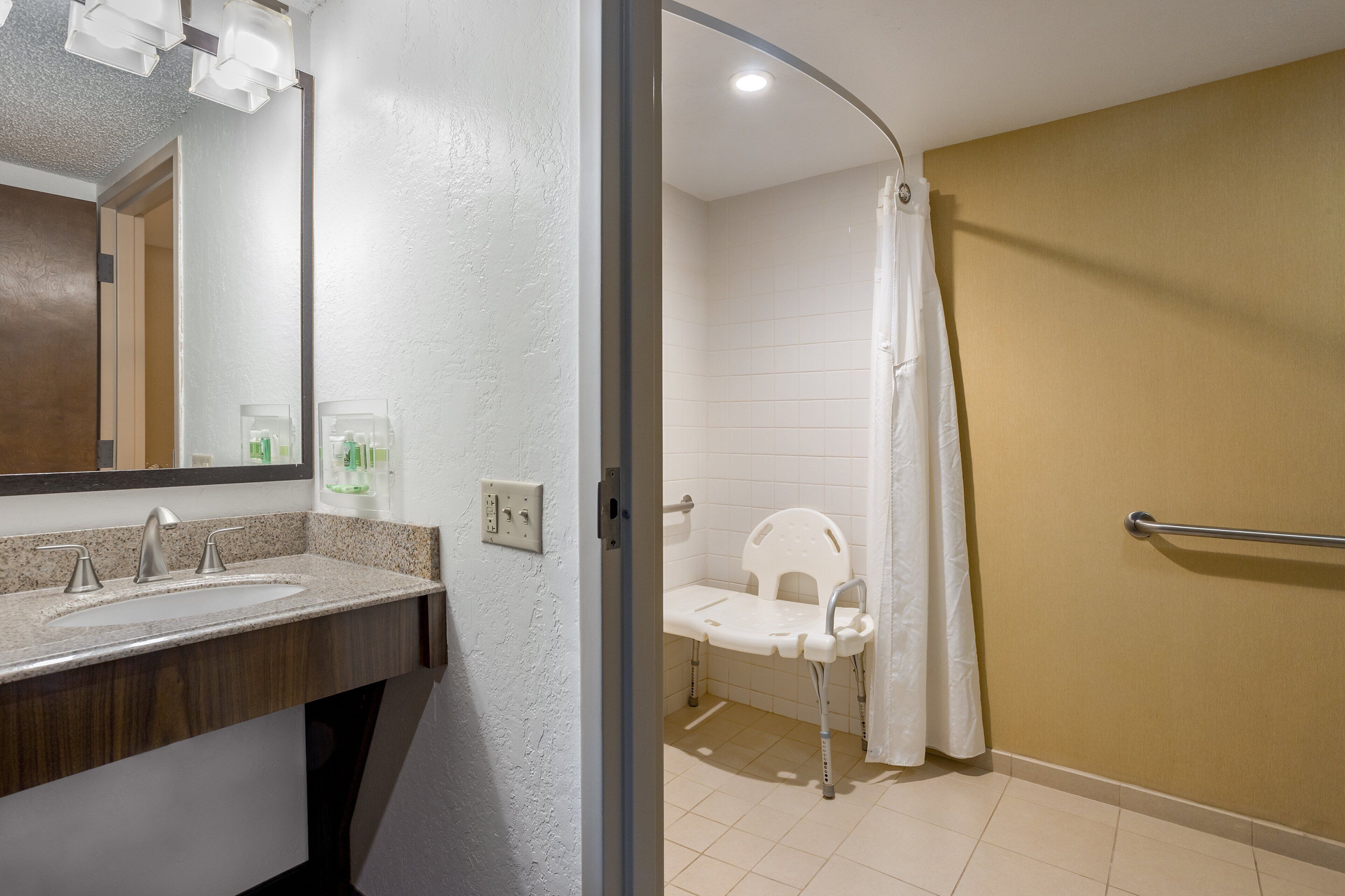 hypo-allergenic bedding, desk, laptop workspace, blackout curtains