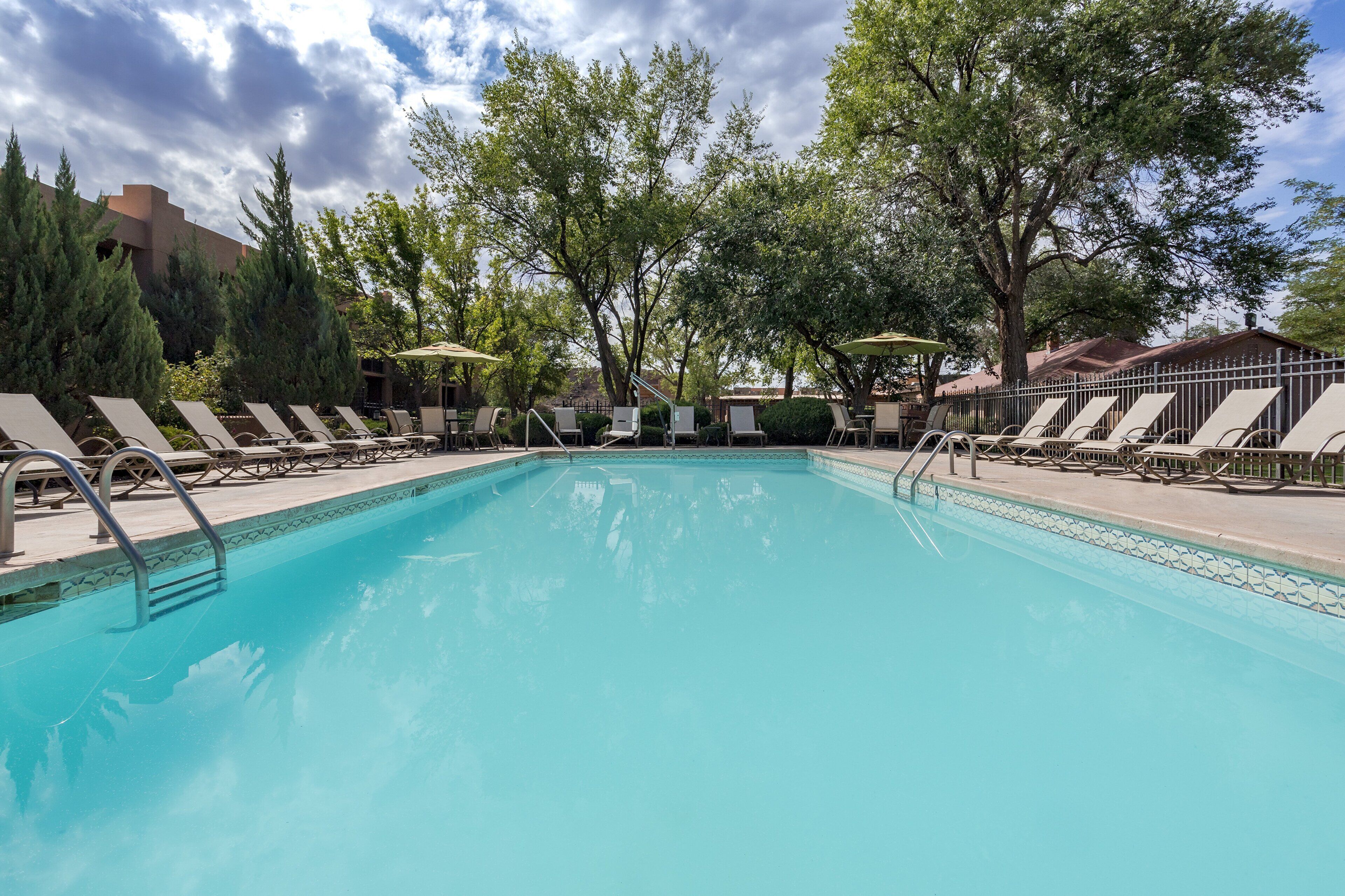 outdoor pool, pool umbrellas, pool loungers