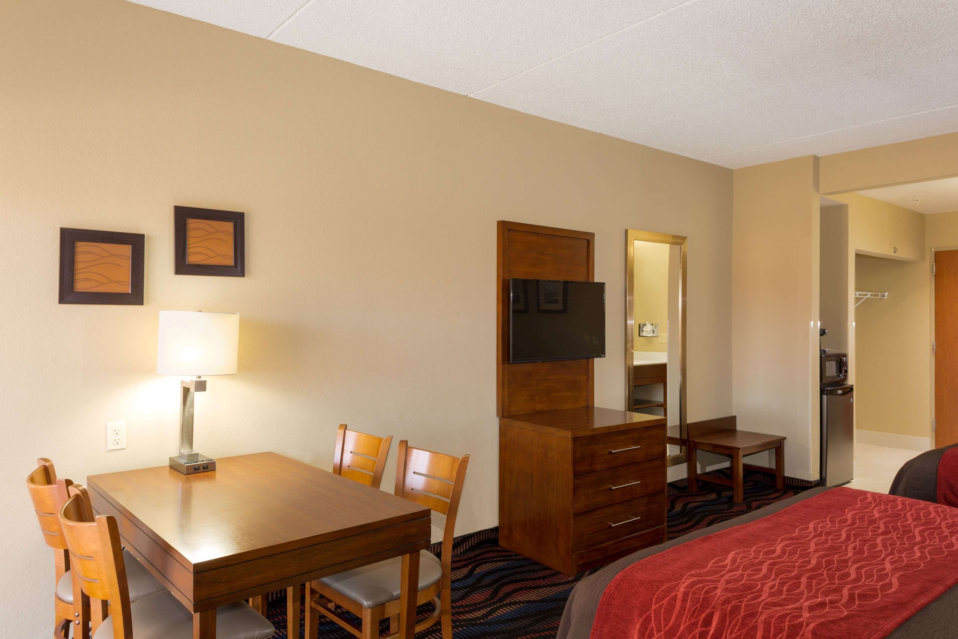 desk, laptop workspace, iron/ironing board, rollaway beds