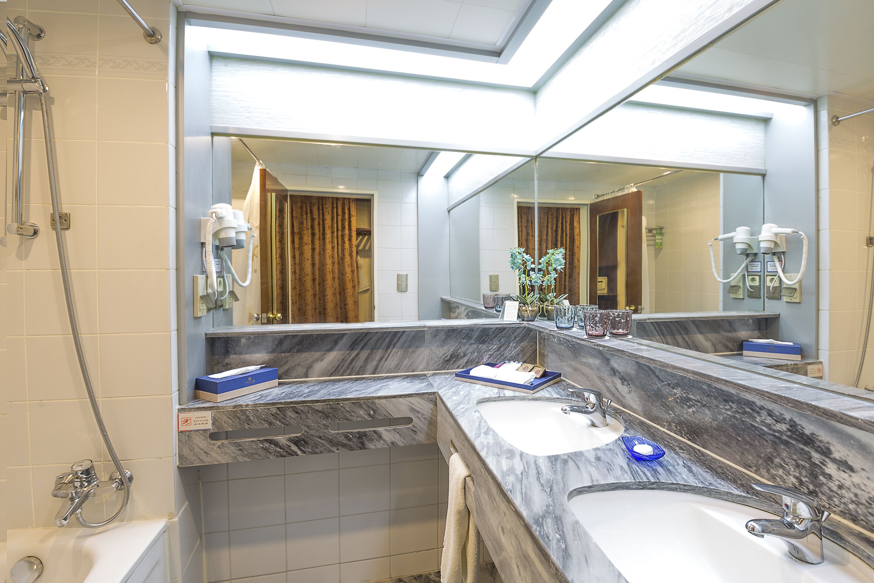 combined shower/bathtub, free toiletries, hair dryer, bathrobes