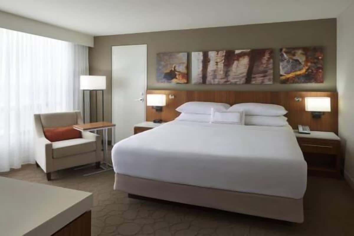 Premium bedding, desk, laptop workspace, blackout drapes