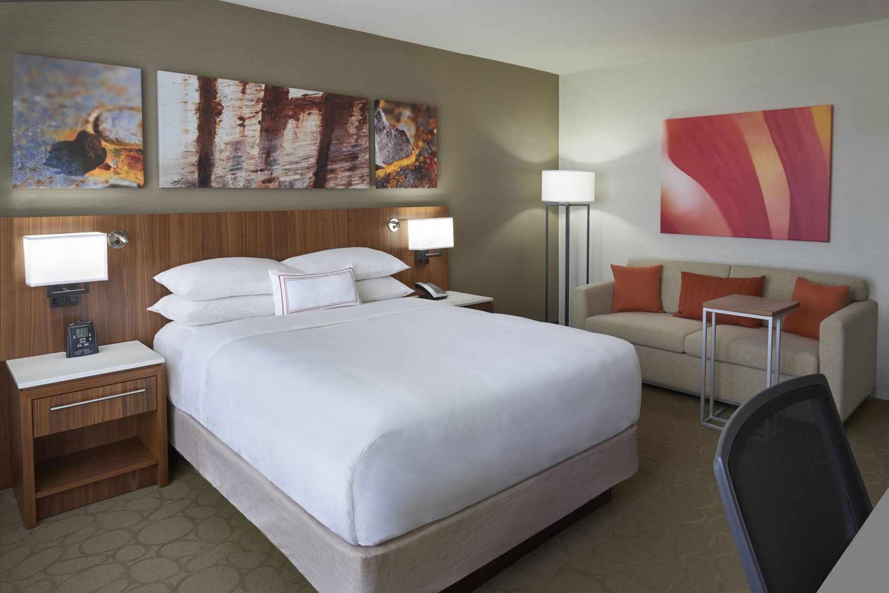 Premium bedding, desk, laptop workspace, blackout drapes