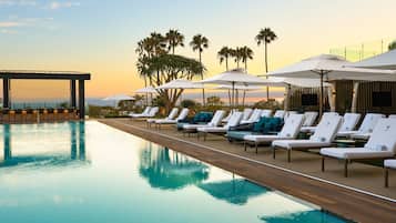 Outdoor pool, open 8:00 AM to 10:00 PM, pool cabanas (surcharge)