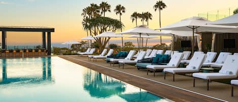 Outdoor pool, open 8:00 AM to 10:00 PM, cabanas (surcharge)