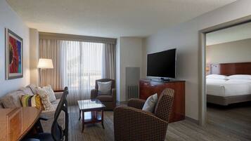 Suite, 1 King Bed | Living area | 50-inch Smart TV with digital channels, TV, Netflix