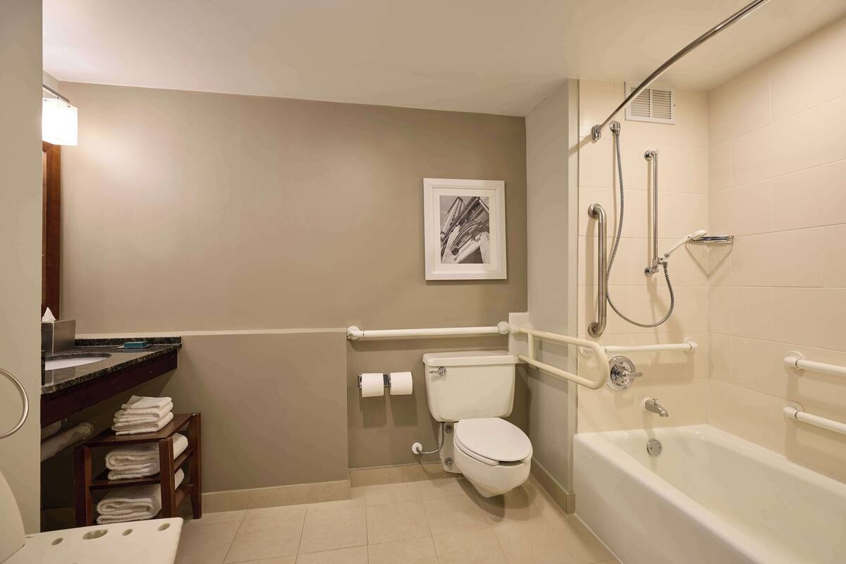 room, 1 king bed, accessible (hearing) | bathroom | combined shower/bathtub, free toiletries, hair dryer, bathrobes