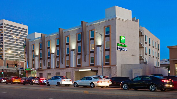 A Holiday Inn Express hotel with a modern design, featuring multiple floors and a prominent sign. - Holiday Inn Express West Los Angeles by IHG (Los Angeles)