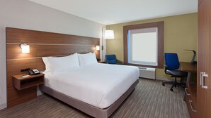 A hotel room with a large bed, bedside tables, a desk with a chair, and a window. - Holiday Inn Express West Los Angeles by IHG (Los Angeles)