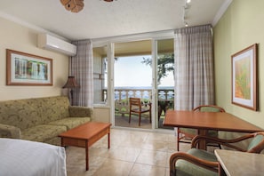 Room, Oceanfront | Living area | Flat-screen TV, DVD player