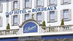 A hotel facade with the sign "GP HOTEL DE BORDEAUX" and "Le Bordeaux" on the entrance.