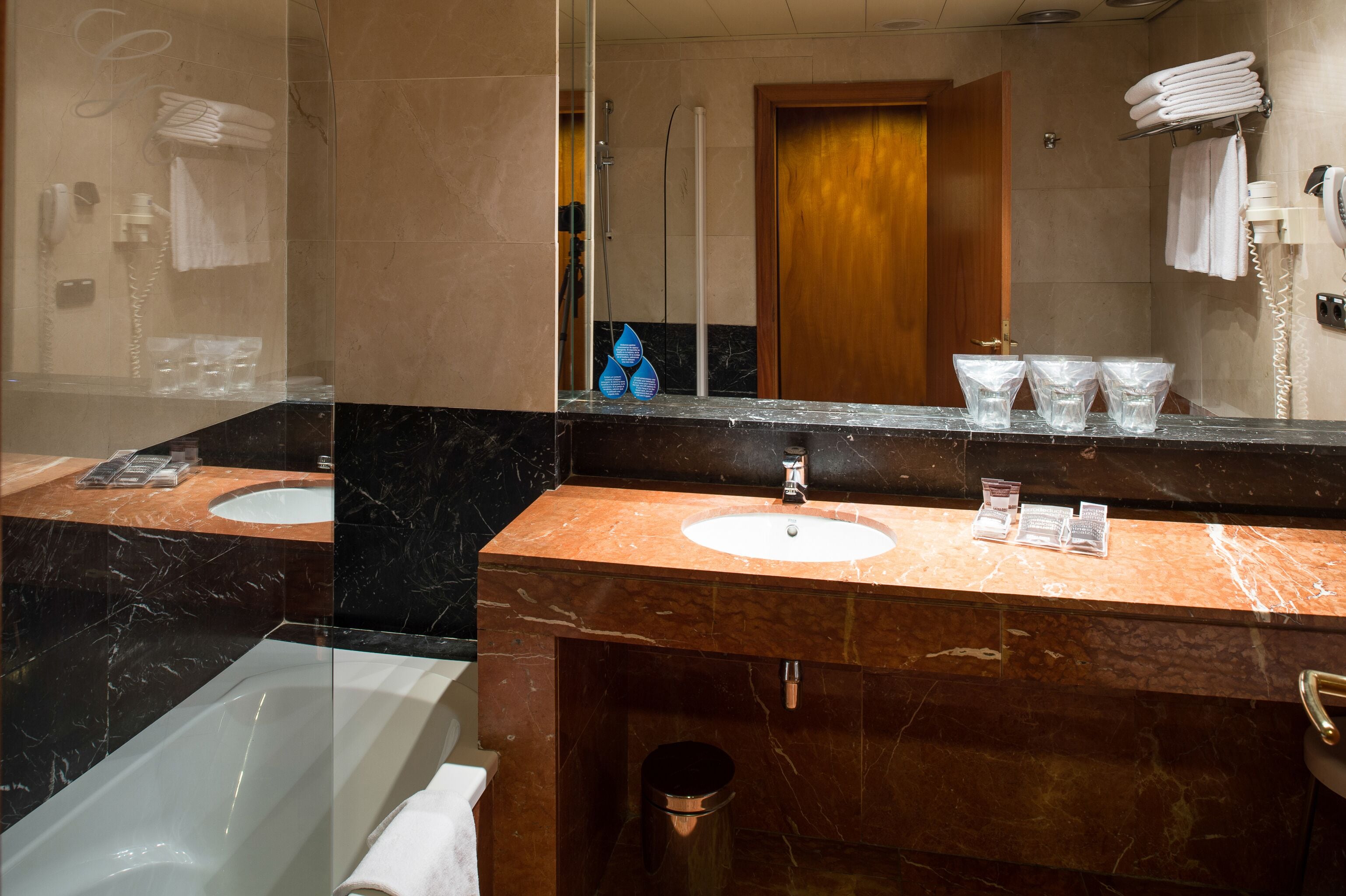 bathtub, eco-friendly toiletries, hair dryer, towels