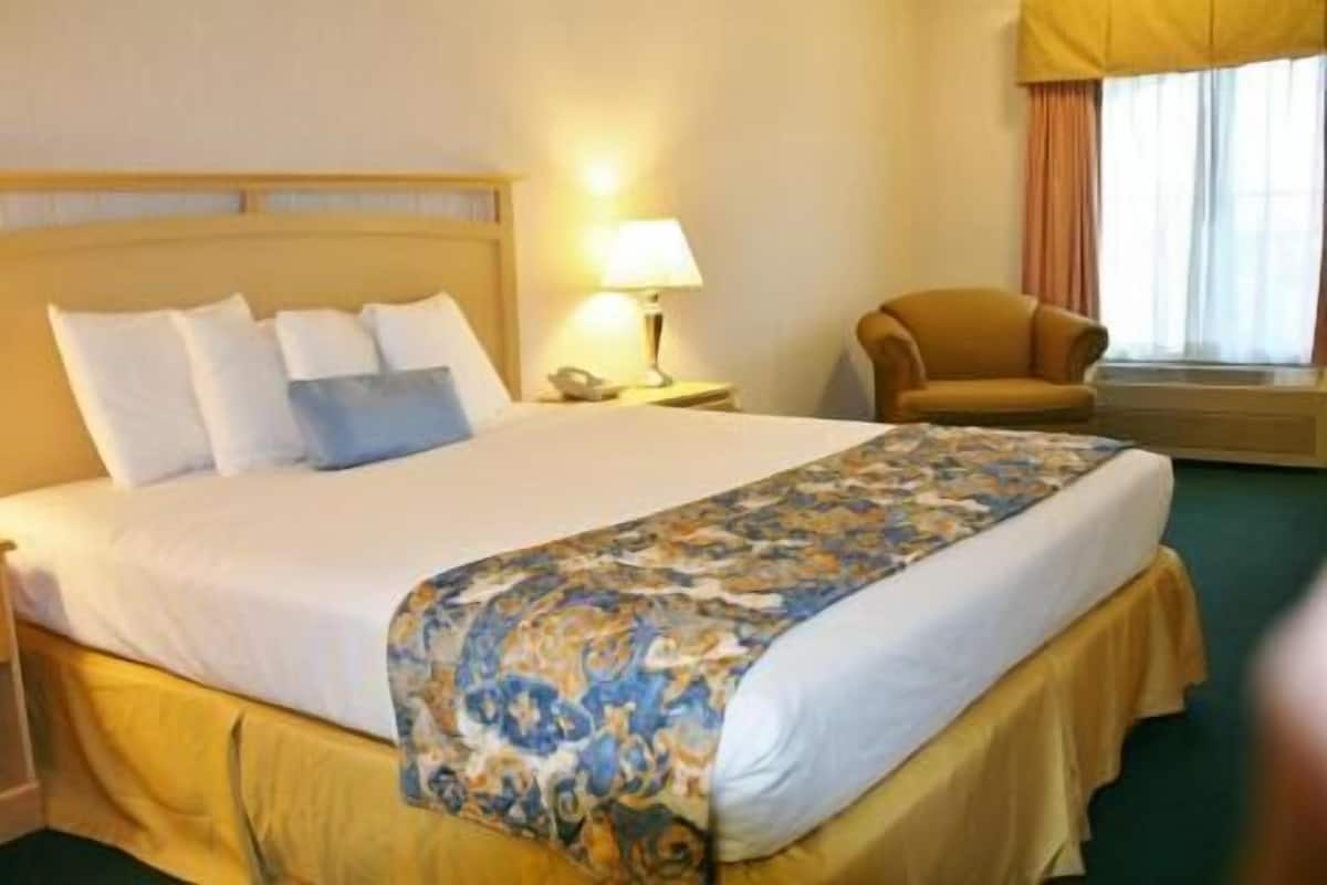 Desk, laptop workspace, blackout drapes, iron/ironing board