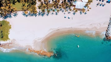 On the beach, sun-loungers, beach umbrellas, beach towels