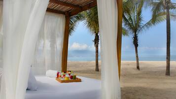 On the beach, sun-loungers, beach umbrellas, beach towels