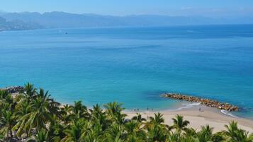 On the beach, sun loungers, beach umbrellas, beach towels
