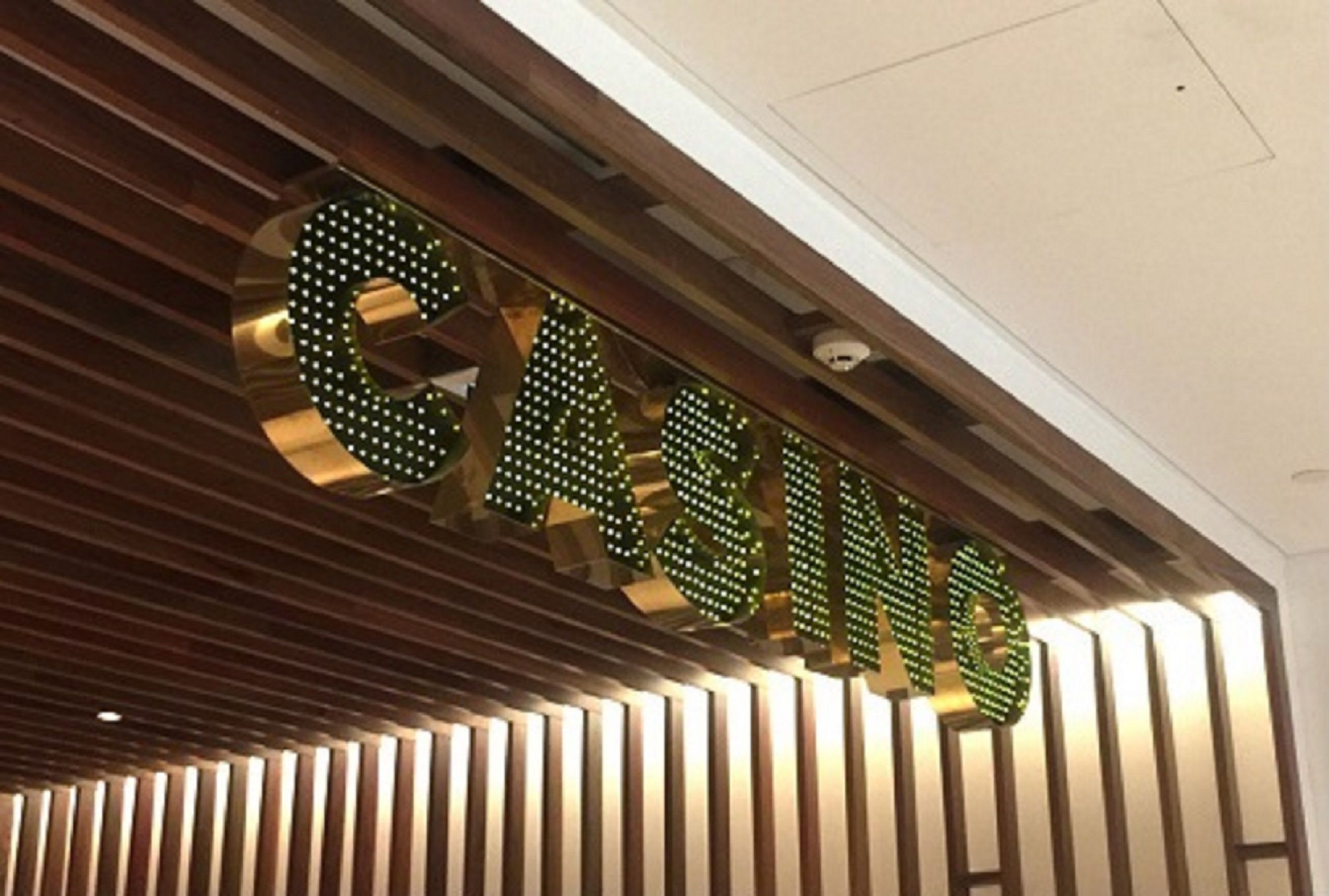 A large illuminated sign with the word "CASINO" in a modern font.