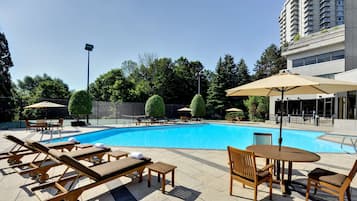 Seasonal outdoor pool, open 10:00 AM to 6:00 PM, pool umbrellas