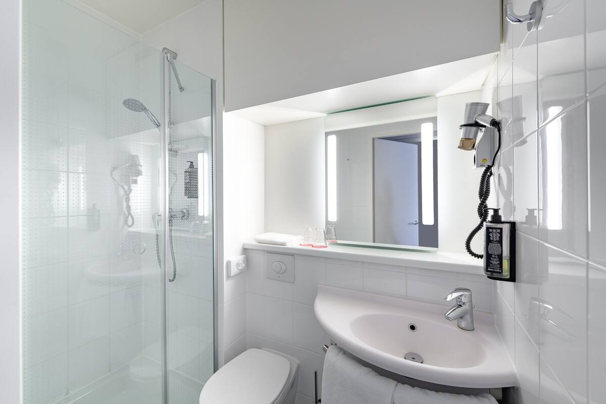 shower, eco-friendly toiletries, hair dryer, towels